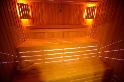 a small sauna with lights on the inside of it at Villa Vejini in Mamkoda