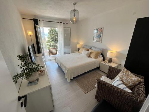 a bedroom with a bed and a living room at Apartments Kale Center in Bol