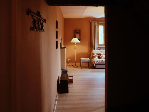 a hallway with a living room with a couch at Holiday Home Niosa by Interhome in Dego