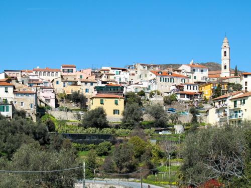 a group of buildings on a hill with a town at Apartment Ruscus by Interhome in Terzorio