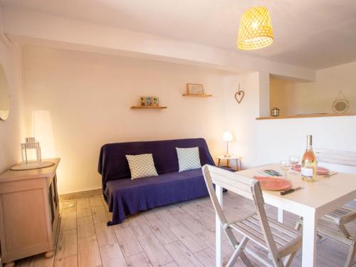 a living room with a couch and a table at Holiday Home Villa Clair de Lune by Interhome in Hyères