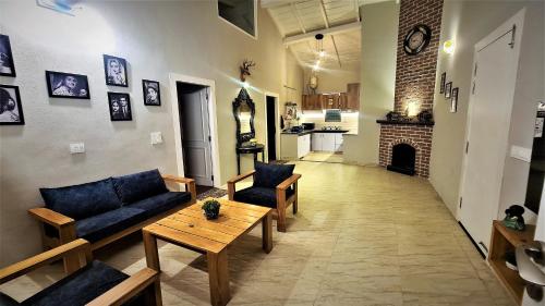 a living room with a couch and a table at Villa KAILASA in Mukteswar