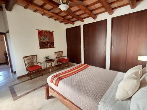 Кровать или кровати в номере Casa Santa Teresita