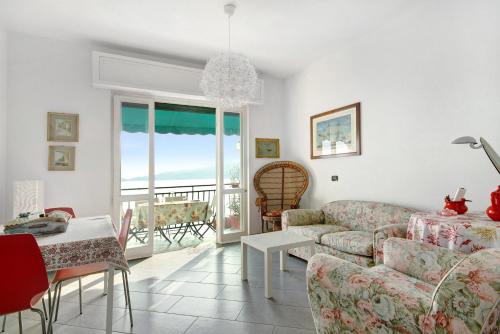 a living room with a couch and a table at La Solatia in Zoagli