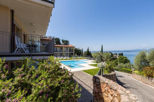 a view of a house with a swimming pool at Residence La Corte Danese in Torri del Benaco