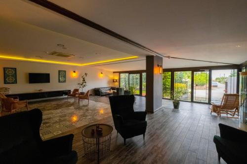 a living room with a couch and a table at Eleia Hotel İznik in Bursa