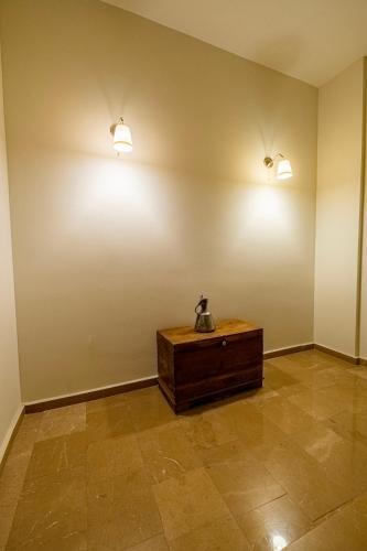 a room with two lights on the wall and a table at Eleia Hotel İznik in Bursa
