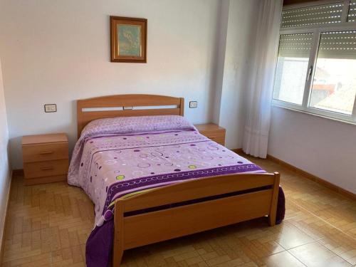 Postel nebo postele na pokoji v ubytování Piso lola 2