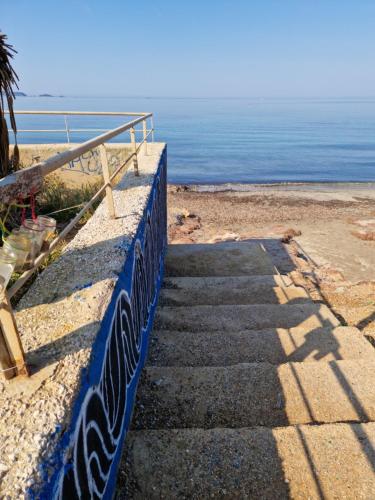 a set of stairs leading down to the beach at Stella Maris in Hyères