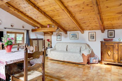 a bedroom with a bed and a table in it at Casa Sasia in Casteldelfino