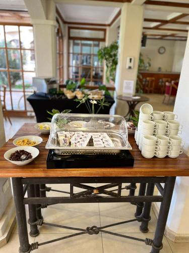 a table with a tray of food on top of it at Hotel y Departamentos La Serena - Caja Los Andes in La Serena