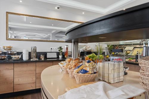 a kitchen with baskets of food on a counter at Ferien & Business Apartments Hotel Adler in Friedrichshafen