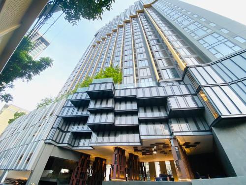 a tall building with windows on the side of it at Edge Central Pattaya Vip Condo in Pattaya Central