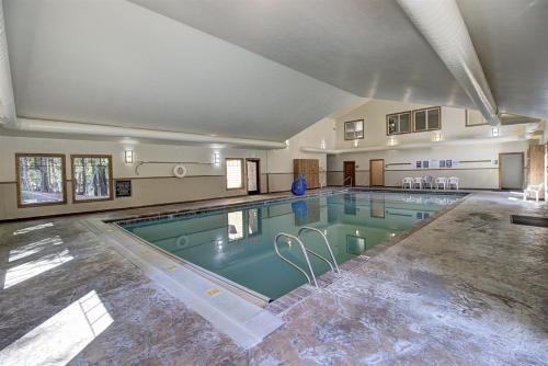 a large swimming pool in a large room at Escape To Ptarmigan Village 82 in Whitefish