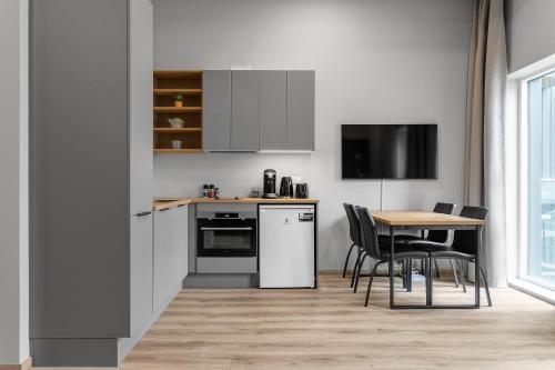 ครัวหรือมุมครัวของ Cozy Studio Apartment