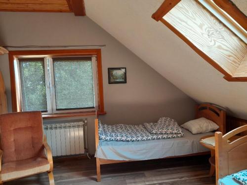 Кровать или кровати в номере Noclegi u Janusza