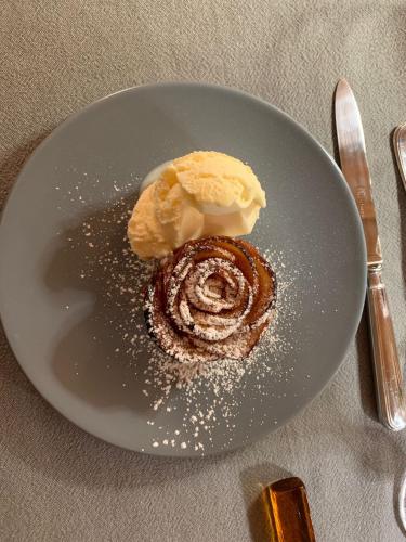 a plate with a dessert on a table at La Corte Nascosta Volpedo in Volpedo