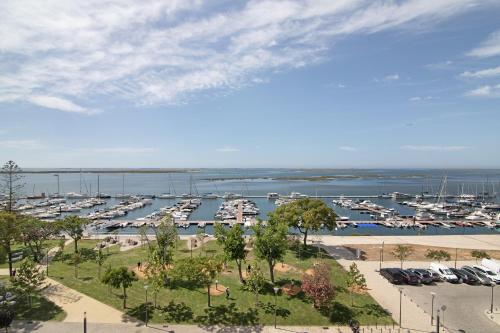 a view of a marina with boats in the water at Mare Nostrum in Olhão
