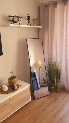 a mirror sitting on top of a dresser in a room at Bandol and Beach pour 2 à 3 personnes in Bandol