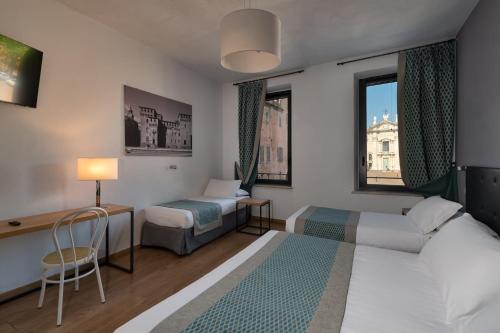 Postel nebo postele na pokoji v ubytování Hotel dei Gonzaga