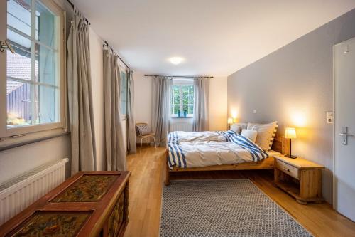 a bedroom with a bed and a window at Klosterhof Eggenreute in Wangen im Allgäu