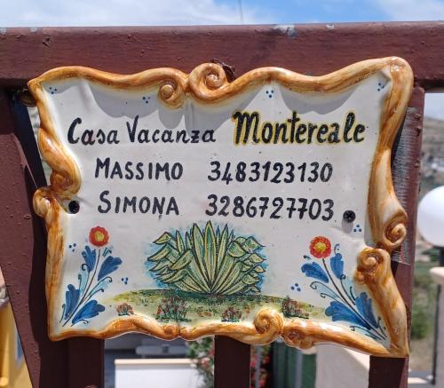 a sign for a moroccan market on a fence at Casa vacanze Montereale in Realmonte