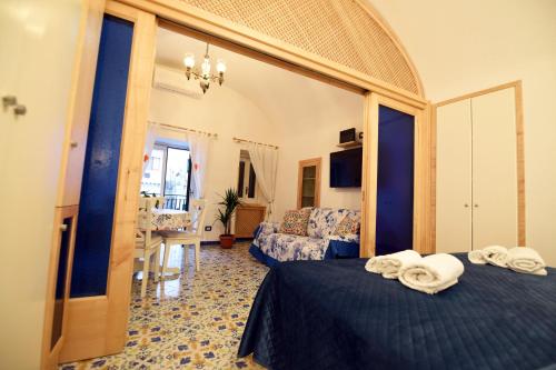 a hotel room with two beds and a mirror at Casa De Rosa in Atrani