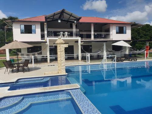 a view of a resort with a swimming pool at QUINTA CAMPESTRE LA FLORIDA in Mariquita