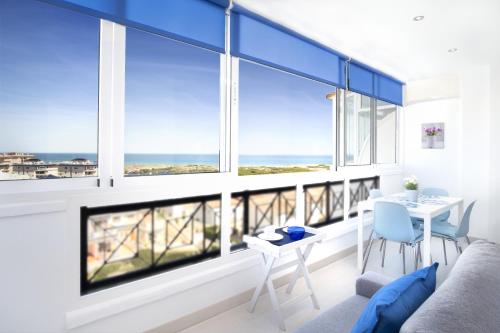 a living room with a view of the ocean at Lighthouse Parquemar in La Mata