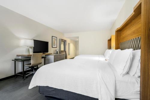 Un ou plusieurs lits dans un hébergement de l'établissement Holiday Inn Orlando International Dr-ICON by IHG