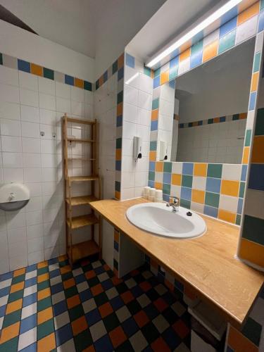 a bathroom with a sink and a mirror at Palác Daun - Studio Apartments in Znojmo