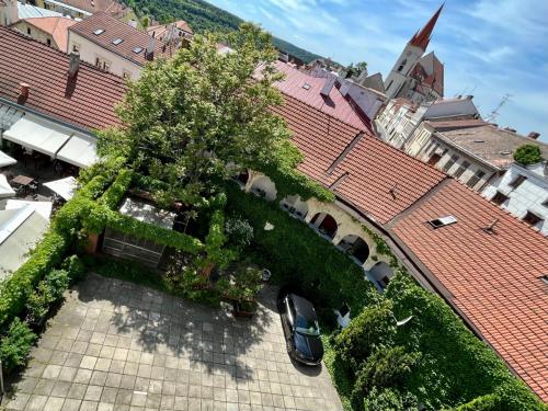 a car is parked on a roof of a building at Palác Daun - Studio Apartments in Znojmo