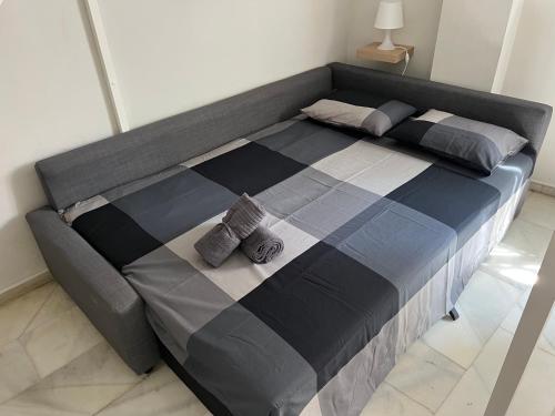 Posteľ alebo postele v izbe v ubytovaní GENUAR APARTMENTS MALAGA CENTER 4