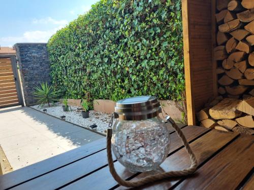 a glass jar on a wooden table with a rope around it at Adosado en Cirueña con Chimenea in Cirueña