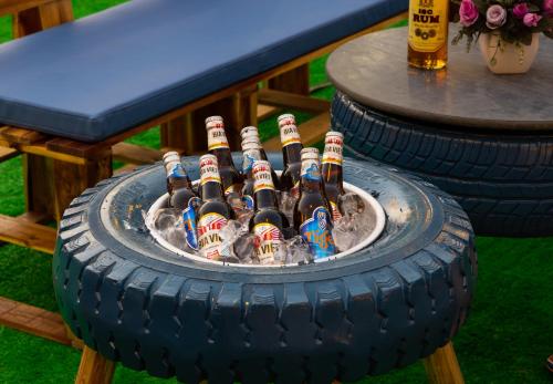 a bunch of bottles of beer in a tire at Mountain Pearl Hotel in Cat Ba