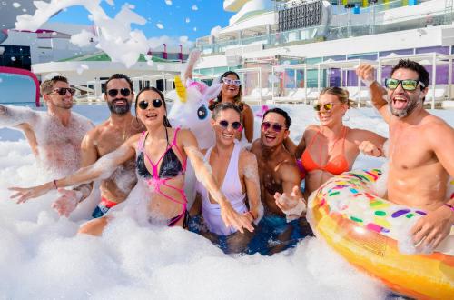 a group of people in the foam on a cruise ship at Temptation at The Tower Cancún Resort - All Inclusive - Adults Only in Cancún