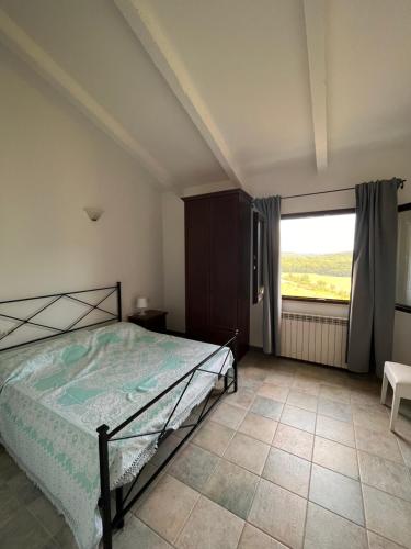 En eller flere senge i et værelse på Agriturismo Pian di Farinello