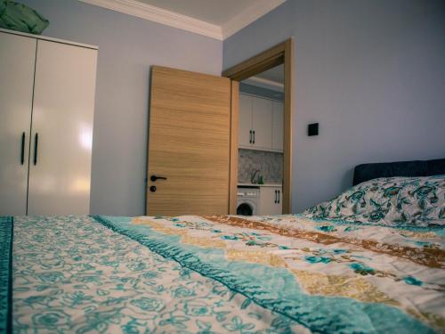 a bedroom with a bed and a closet and a door at New Village Home, Near to Beaches-Natural Zone in Ortaca