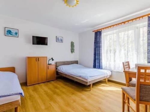 Postel nebo postele na pokoji v ubytování Pokoje Gościnne Irys