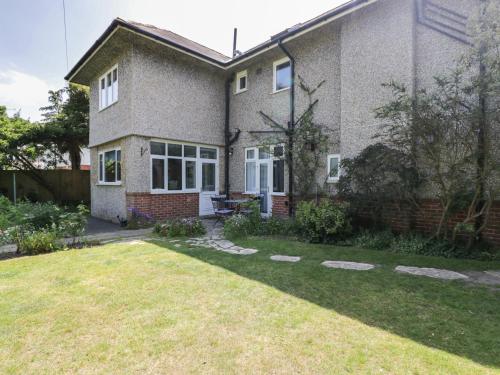 a large house with a yard in front of it at Molly's Place in Bournemouth