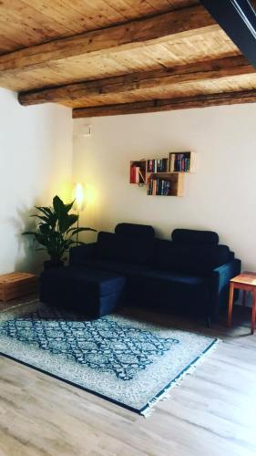 a living room with a couch and a rug at Split in Veberöd