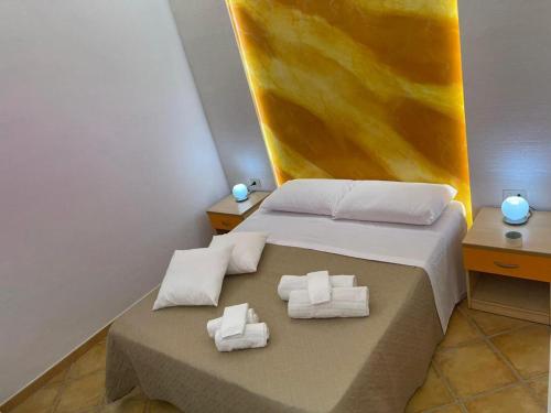 Postel nebo postele na pokoji v ubytování "L'Oasi di Favignana" Room and Charme