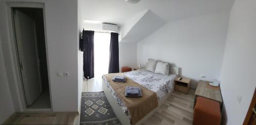 Un pat sau paturi într-o cameră la Casa SoRal