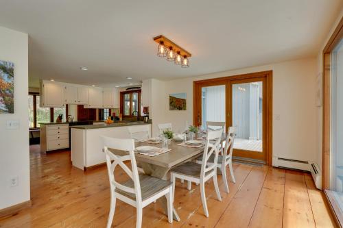 a kitchen and dining room with a table and chairs at Mendon Home with Hot Tub, Fire Pit and Near Skiing! in Mendon