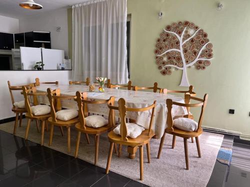 a dining room with a table and chairs at Casa River in Băişoara