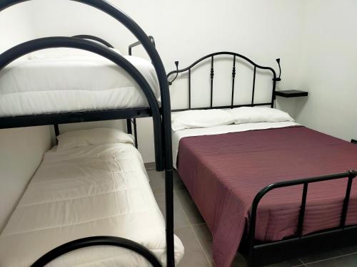 Postel nebo postele na pokoji v ubytování BILOCALE Villa Lara