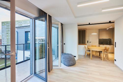 a view from the living room of a apartment with sliding glass doors at Apartamenty Świnoujście - Matejki 1b in Świnoujście
