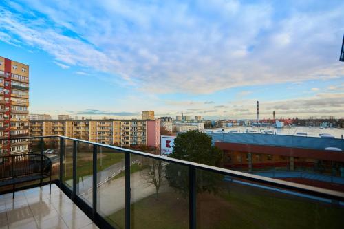 a balcony with a view of a city at Apartamenty Świnoujście - Matejki 1b in Świnoujście