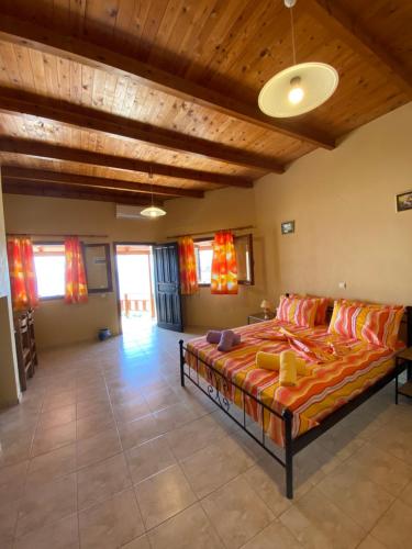 a bedroom with a large bed in a room at Gavdos Panorama in Gavdos