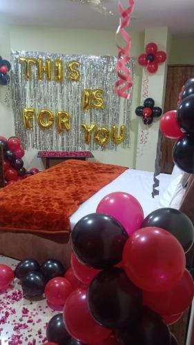 a party with balloons and a sign that reads this is for you at Shagun Banquet and Hotel in Gwalior